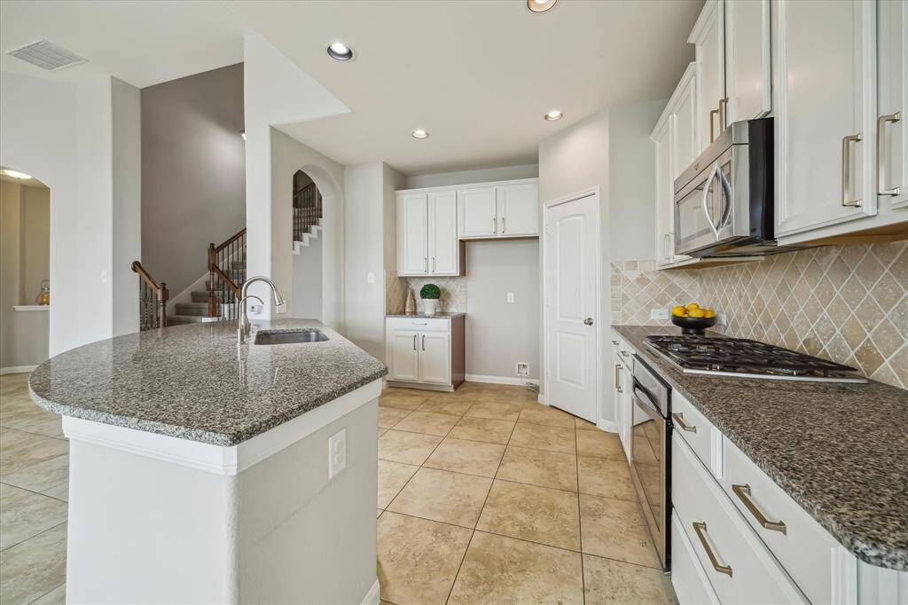 There is ample storage and counter space throughout this kitchen to prep all your meals