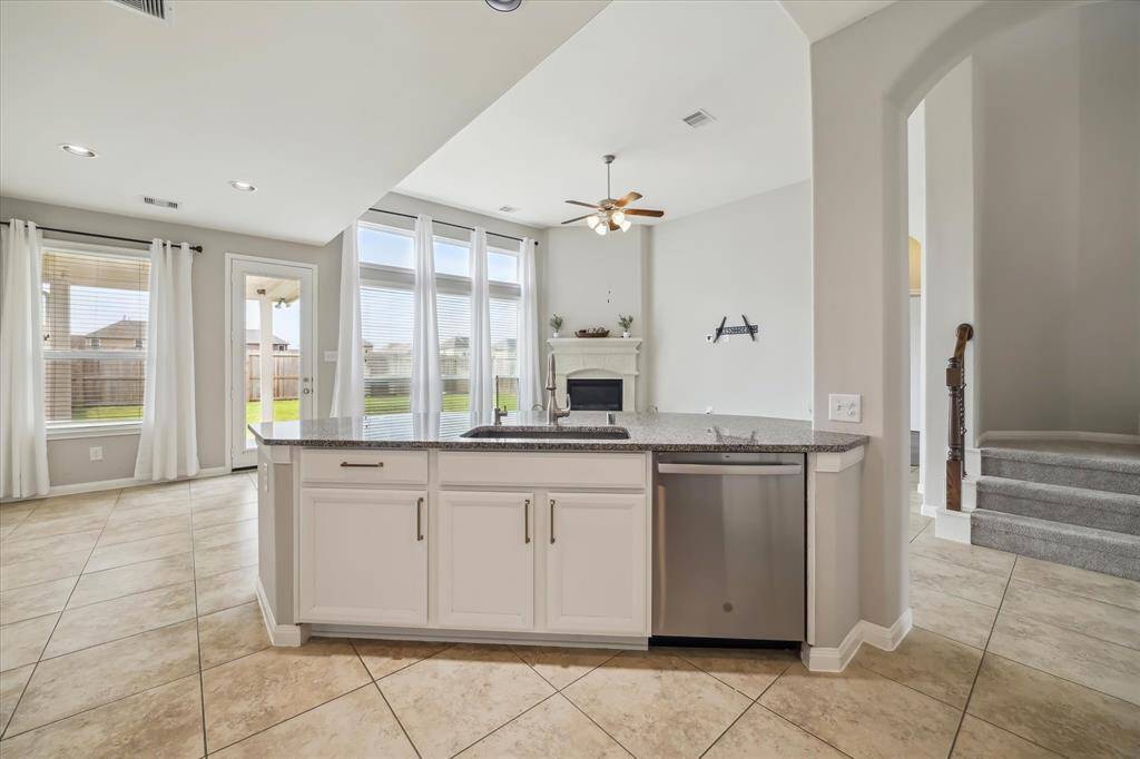 Never miss a thing as this kitchen layout allows you to stay engaged with the family, whether they are inside lounging or out, enjoying the privacy of the yard