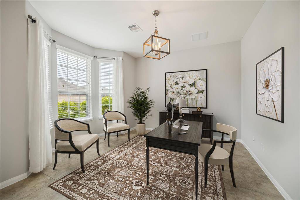 Dedicated study located at the front of the home with a wall of windows for tons of natural light *virtually staged