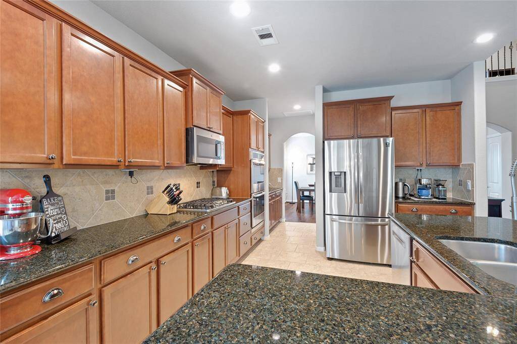 One more view of the immaculate and spacious kitchen.   Waiting for you to bake that cake or perhaps a family dinner.
