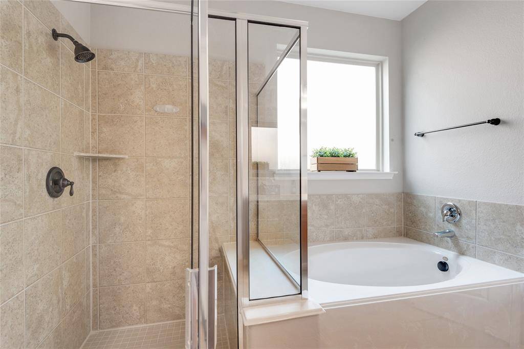Get your bubbles ready for a relaxing soak in the tub and notice the walk in shower has a convenient bench seat.