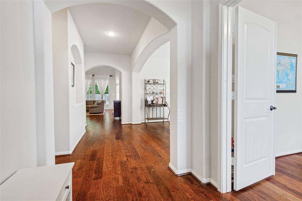 Enjoy the formal entry as a place to welcome your guests into your new home. Beautiful wood door has been thoughtfully added recently.