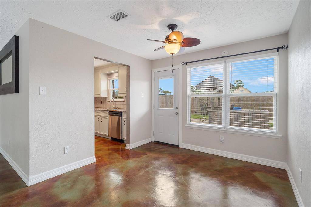 Dining area with a window overlooking your backyard oasis!