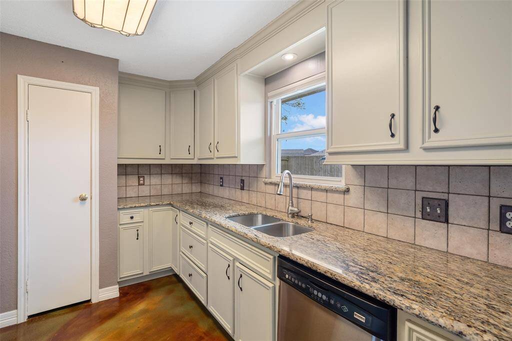 Kitchen featuring granite countertops space and plenty of storage!