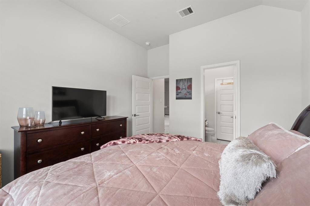 To the right of the entryway is a secondary bedroom #1 with its own en suite.