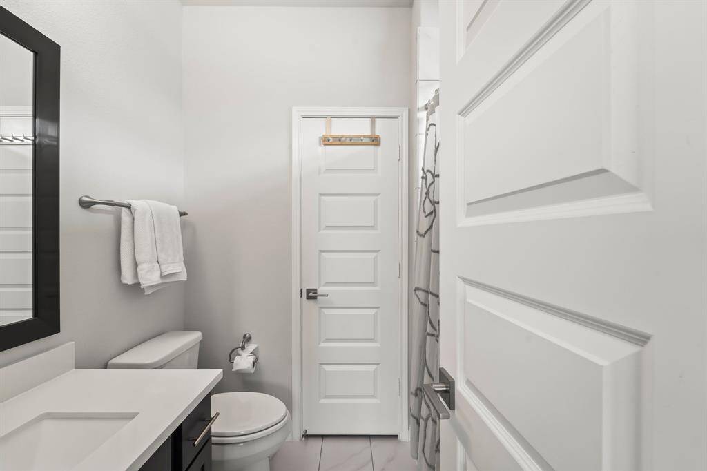 Full bathroom off of secondary bedroom #1.