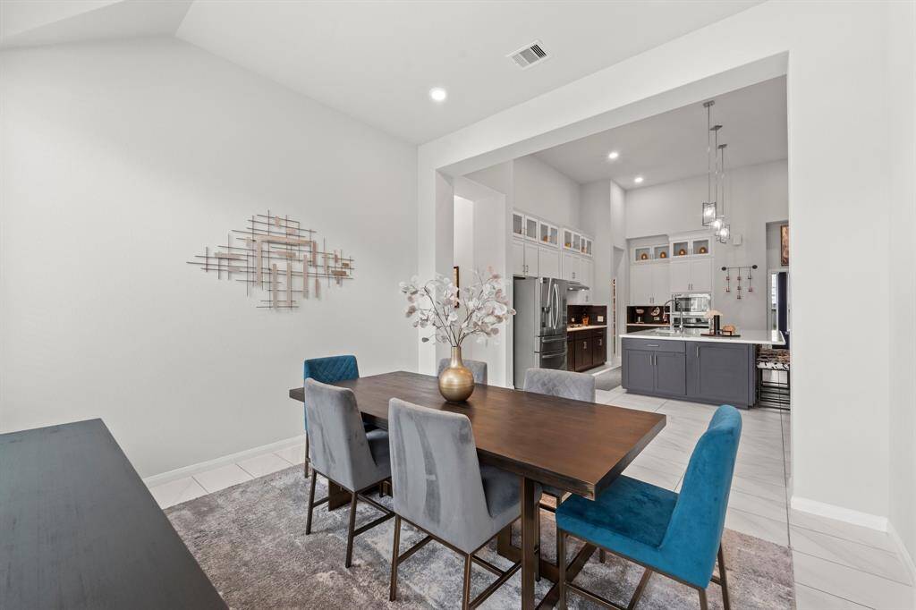 This dining room is tucked away just enough from the main kitchen area, but still with easy access.