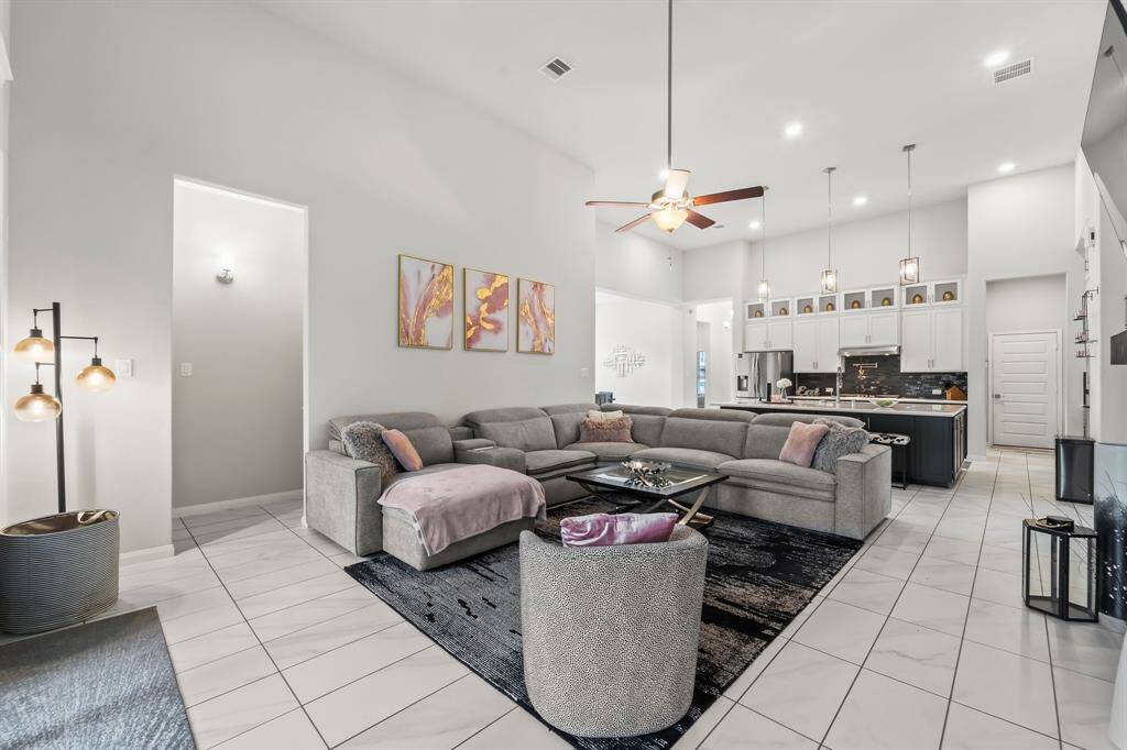 View of the family room and kitchen area from the back door.