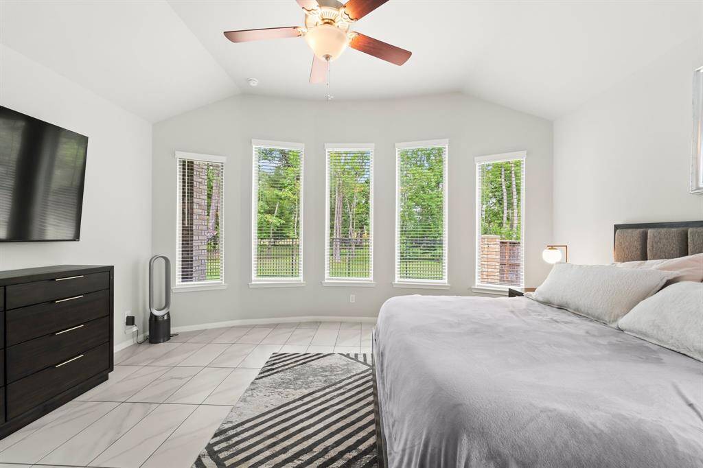 Gorgeous views of the backyard from the Primary bedroom off the back of the home.