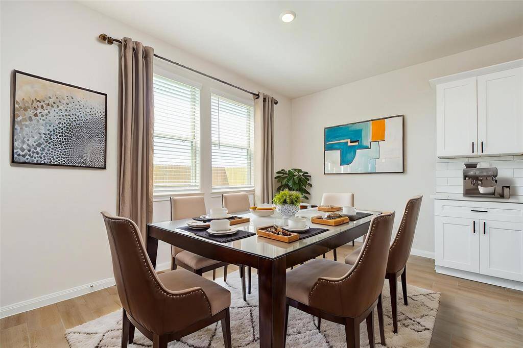This dining space features a bright, airy ambiance.