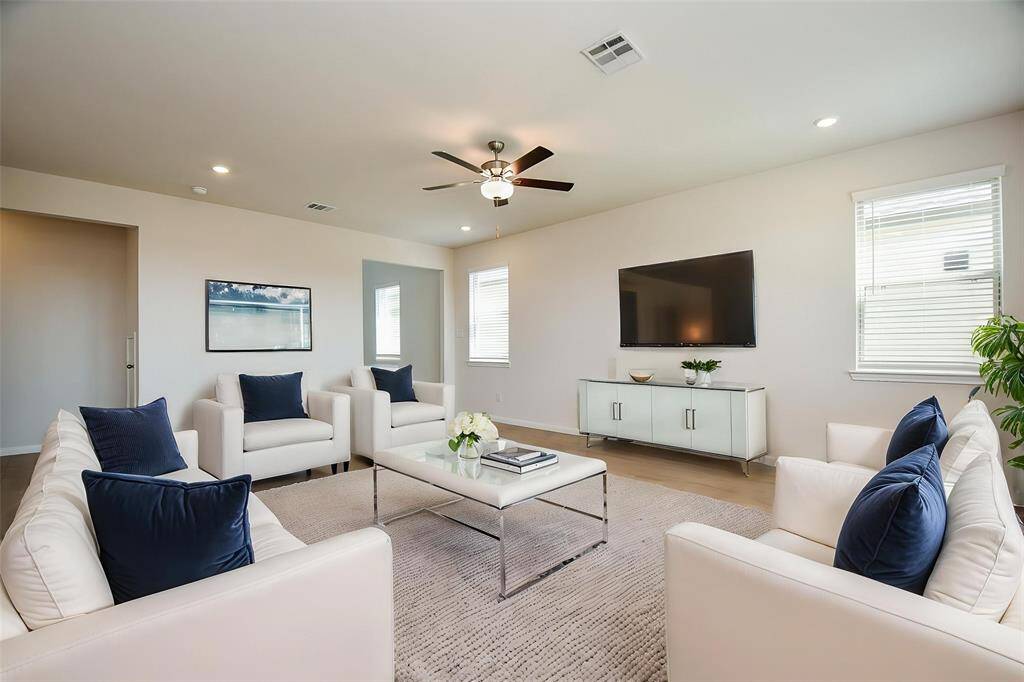 The elegant wood-look flooring that extends throughout the main living areas, adding warmth and sophistication.