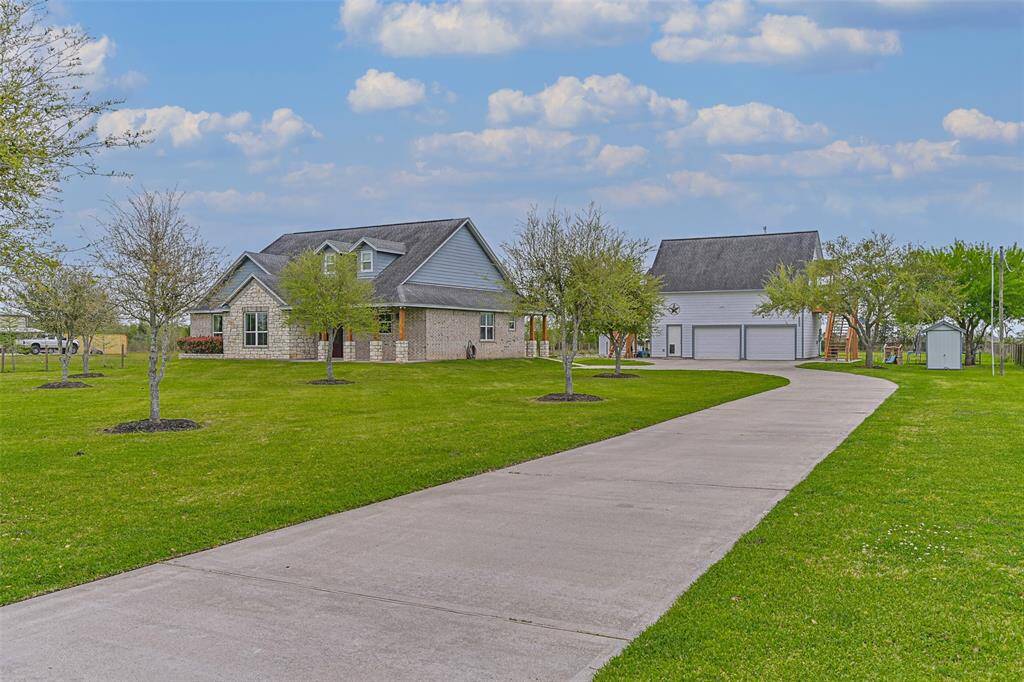 Country living close to city amenities. Custom built home located on 1.925 acres with a garage apartment.