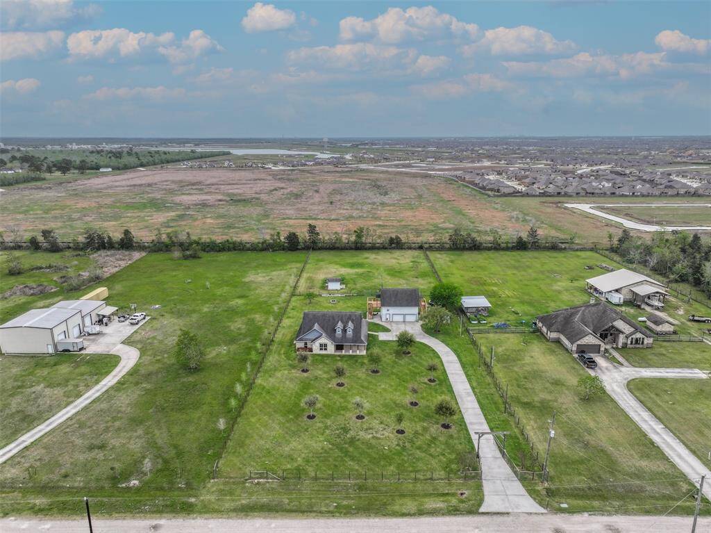 Country living close to city amenities. Custom built home located on 1.925 acres with a garage apartment.