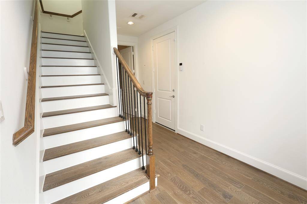 Front door entry - door on right goes to the 2-car garage - door in front goes to the 3rd bedroom and leads out to the back patio - full bath and closet as well - plus additional storage understairs
