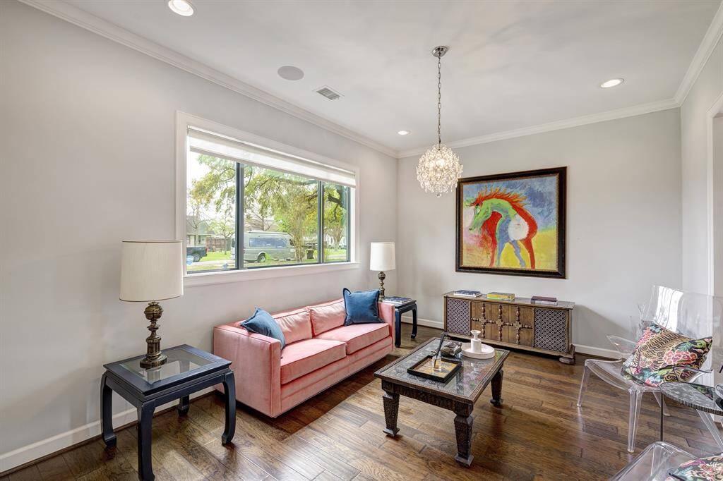 At the front of the home, a formal living space allows intimate conversations, a relaxing glass of wine, a place to unwind.