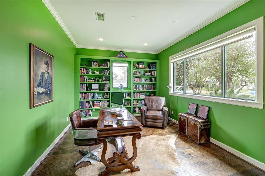 Just to the right of the entry, this stimulating office for work from home looks out onto the front yard.