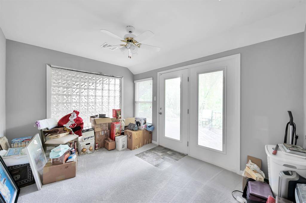 View of sunroom with private door leading to back deck.