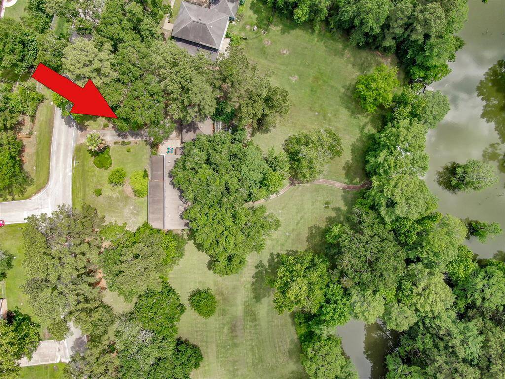 View of home, extra lot and portion of the lake.