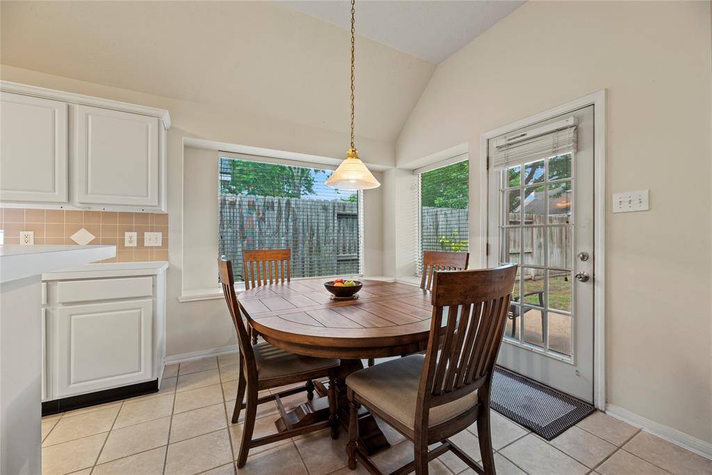 A spacious center island with a dedicated  and workstation offers both functionality and style, perfect for meal prep, and extra storage.