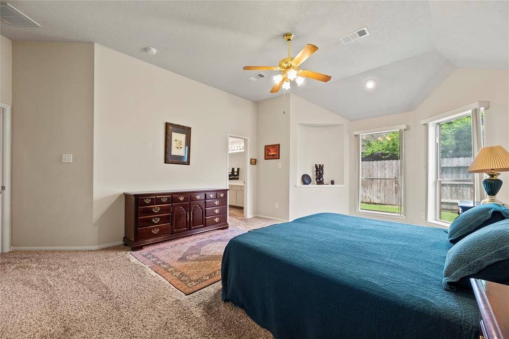 How perfect is this primary suite? Spacious and filled with natural light, this serene retreat offers the ultimate escape, promising comfort, tranquility, and pure relaxation.