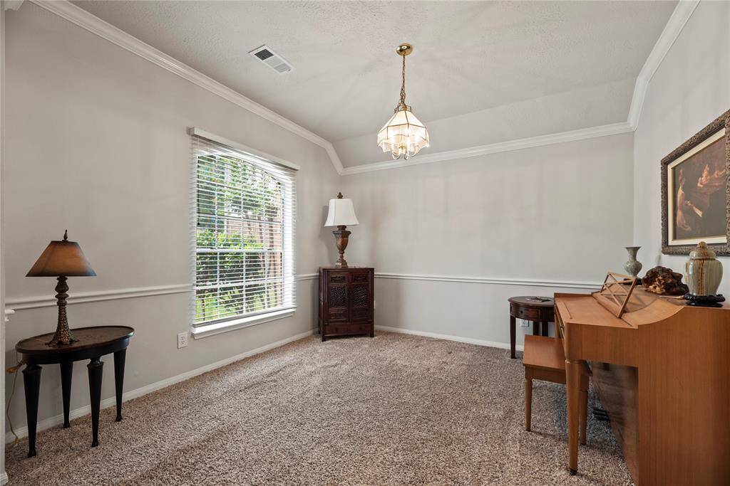 As you step through the front door, you're welcomed by two elegant art niches and low-maintenance tile flooring that combines style with practicality.