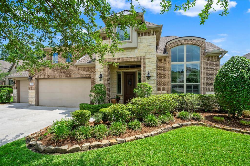 Your dream home awaits! This stunning brick and stone facade is complemented by lush landscaping, offering a warm and inviting entrance. Embrace comfort and elegance in this perfect blend of style and charm.