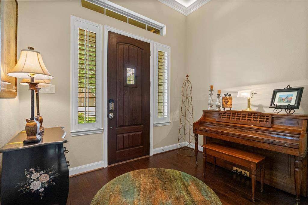Spacious foyer featuring elegant hardwood floors.