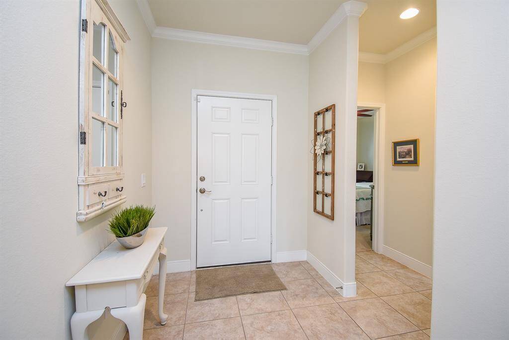 Welcome to your new home! Step into a spacious entryway that sets the tone for comfortable living. To the left, you'll find a full bathroom and a well-sized secondary bedroom—ideal for guests or family.