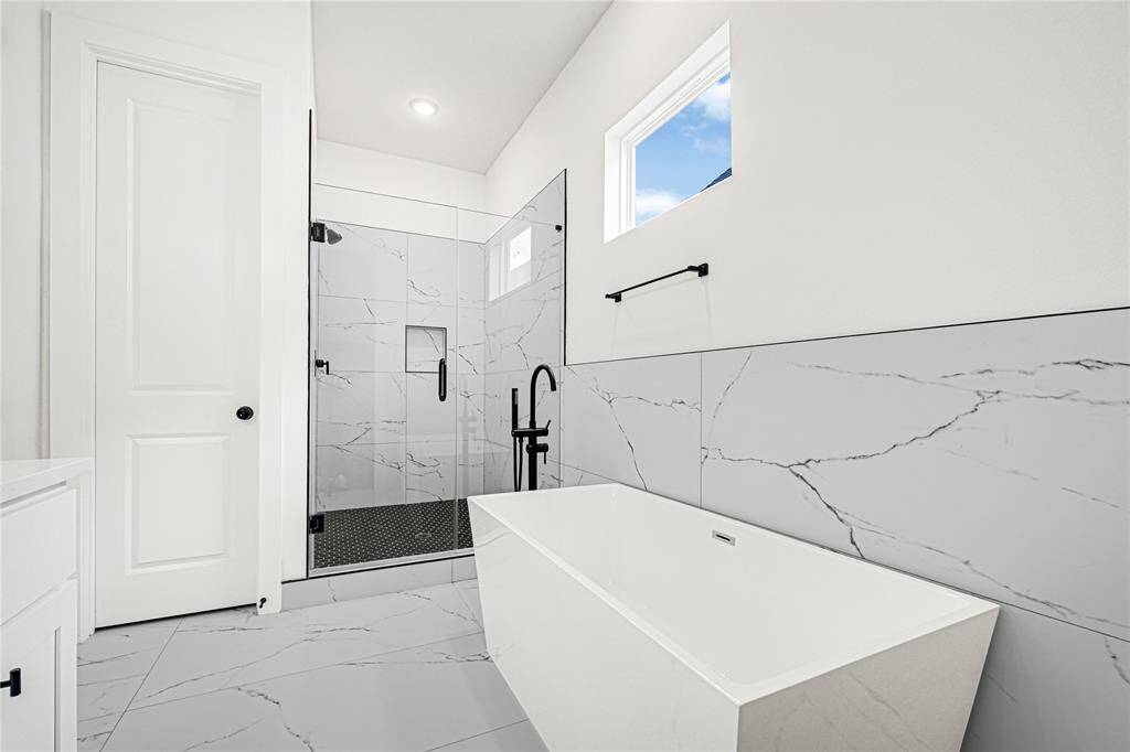 primary bathroom with soak in tub