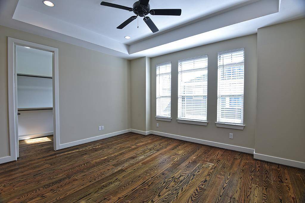 Hardwood floors continue to the 3rd floor into the primary bedroom