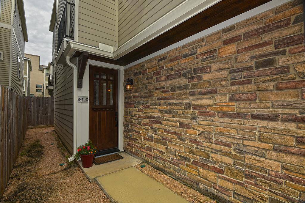 Beautiful stacked stone guides you to the front door