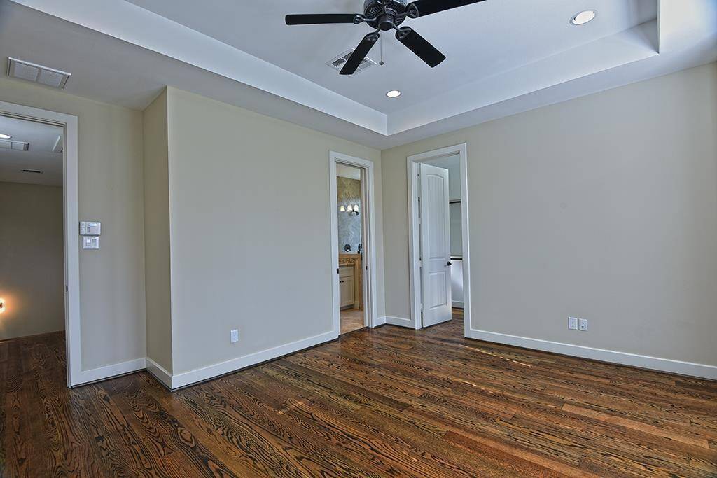 Alternate view of primary looking into the hallway, bathroom and closet