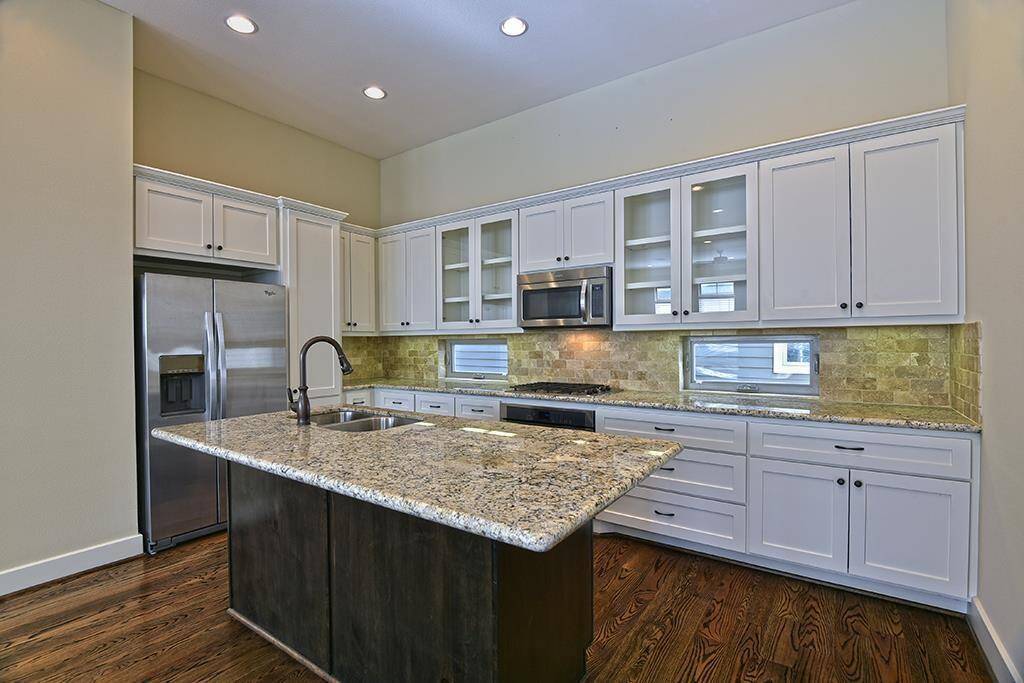 SS appliances, gas cook top and island sink!