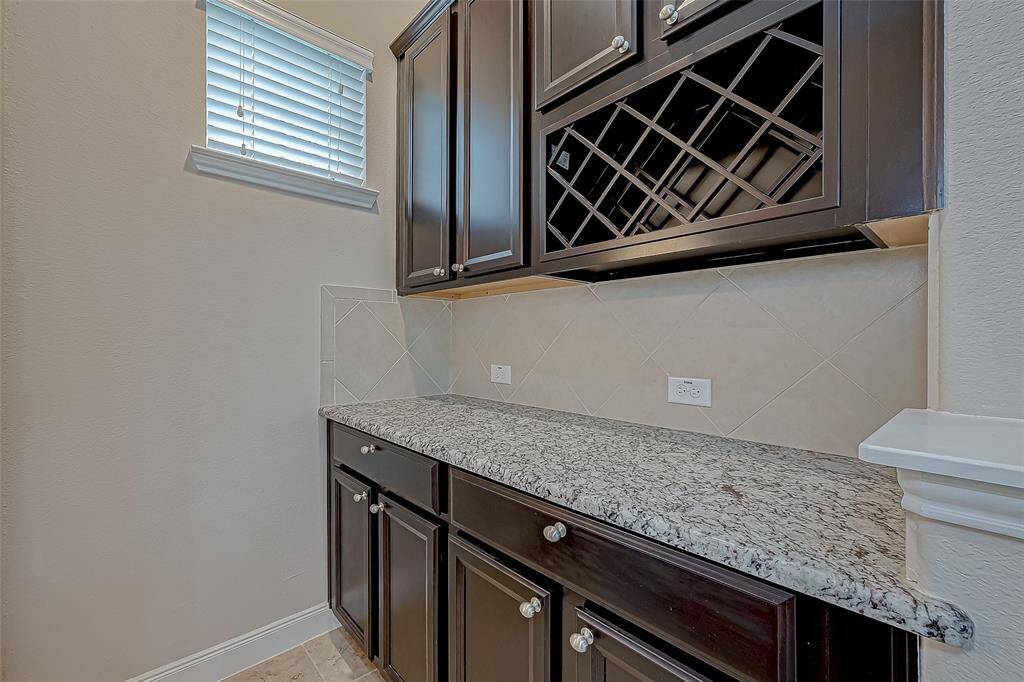 A wine cellar room adds a touch of sophistication, perfect for wine enthusiasts and ideal for entertaining guests.