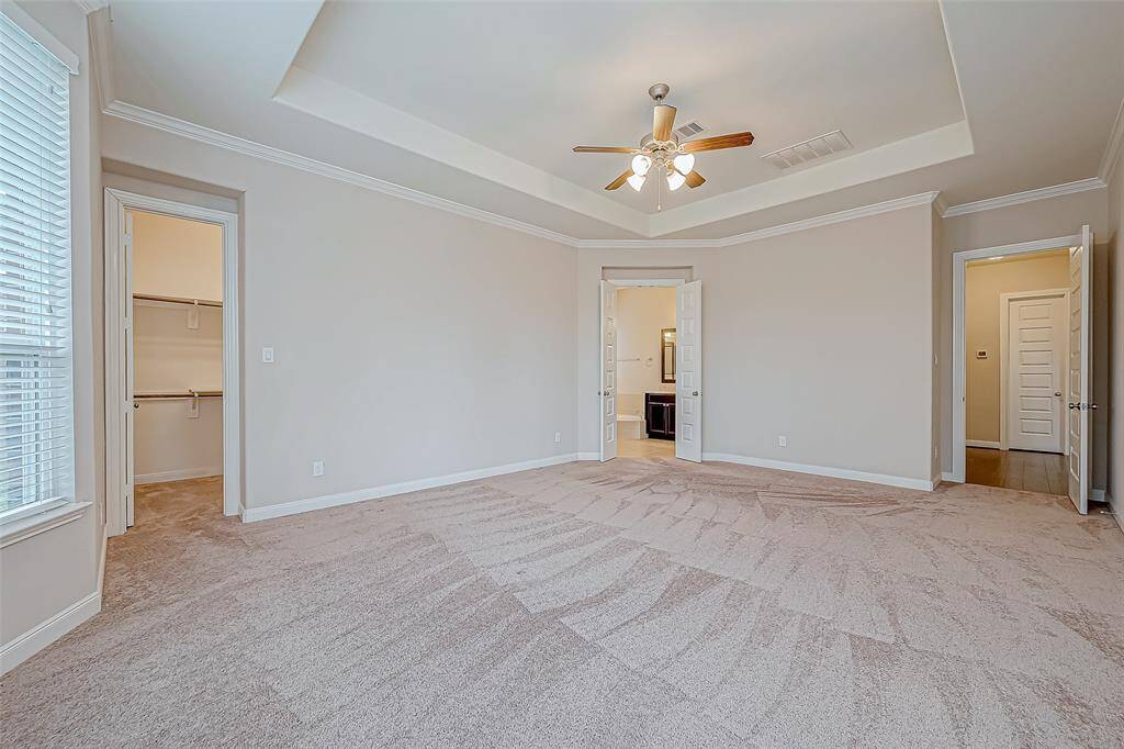 The master bedroom is a spacious and tranquil retreat, featuring large windows that let in plenty of natural light. With plenty of room for a king-sized bed and additional furniture, it offers a peaceful escape with a relaxing atmosphere.