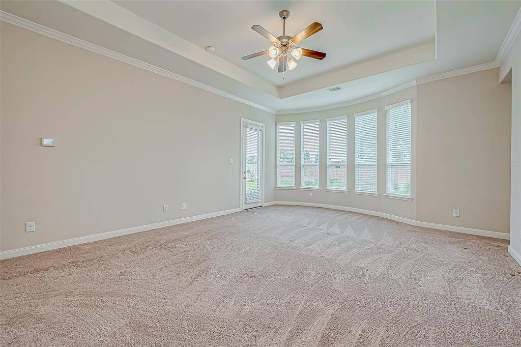 The master bedroom is a spacious and tranquil retreat, featuring large windows that let in plenty of natural light. With plenty of room for a king-sized bed and additional furniture, it offers a peaceful escape with a relaxing atmosphere.