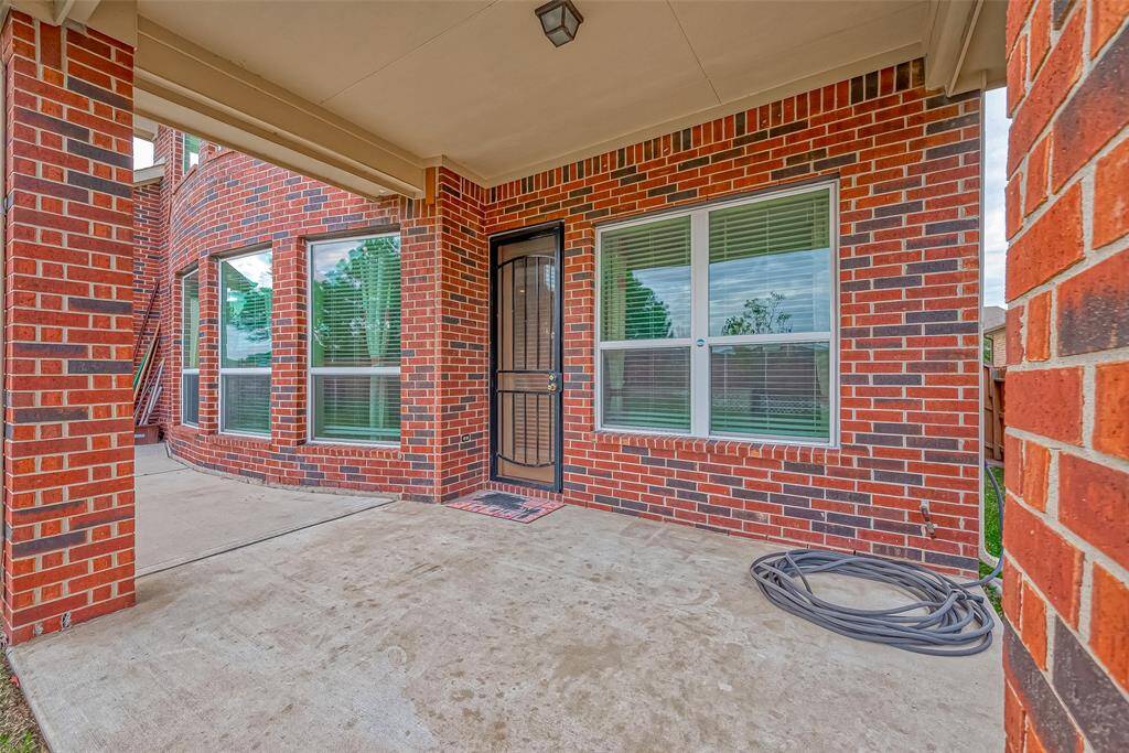 The backyard features a cozy porch, perfect for outdoor relaxation and enjoying the surrounding views. It provides an ideal space for lounging, dining, or entertaining guests.