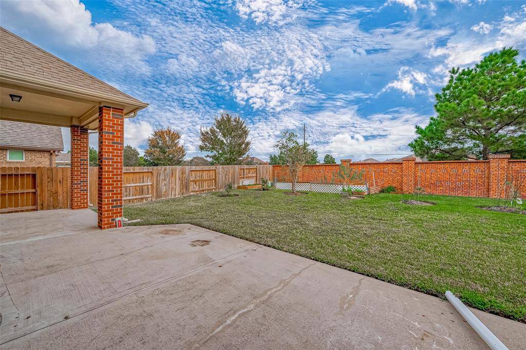The large, spacious backyard offers plenty of room for outdoor activities, gardening, or entertaining. It provides a perfect setting for family gatherings and enjoying the outdoors.