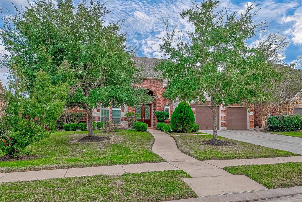 Enjoy the beautifully maintained sidewalks and lush greenery, perfect for peaceful strolls or energizing walks. This inviting neighborhood setting enhances your outdoor lifestyle.