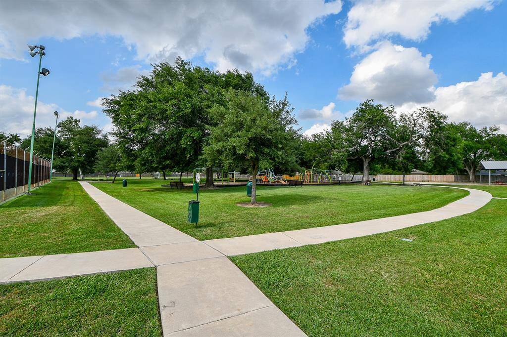 Well-maintained park with lush green lawns, a playground, and a network of walking paths. It's an ideal spot for families and outdoor activities, offering a peaceful community environment.
