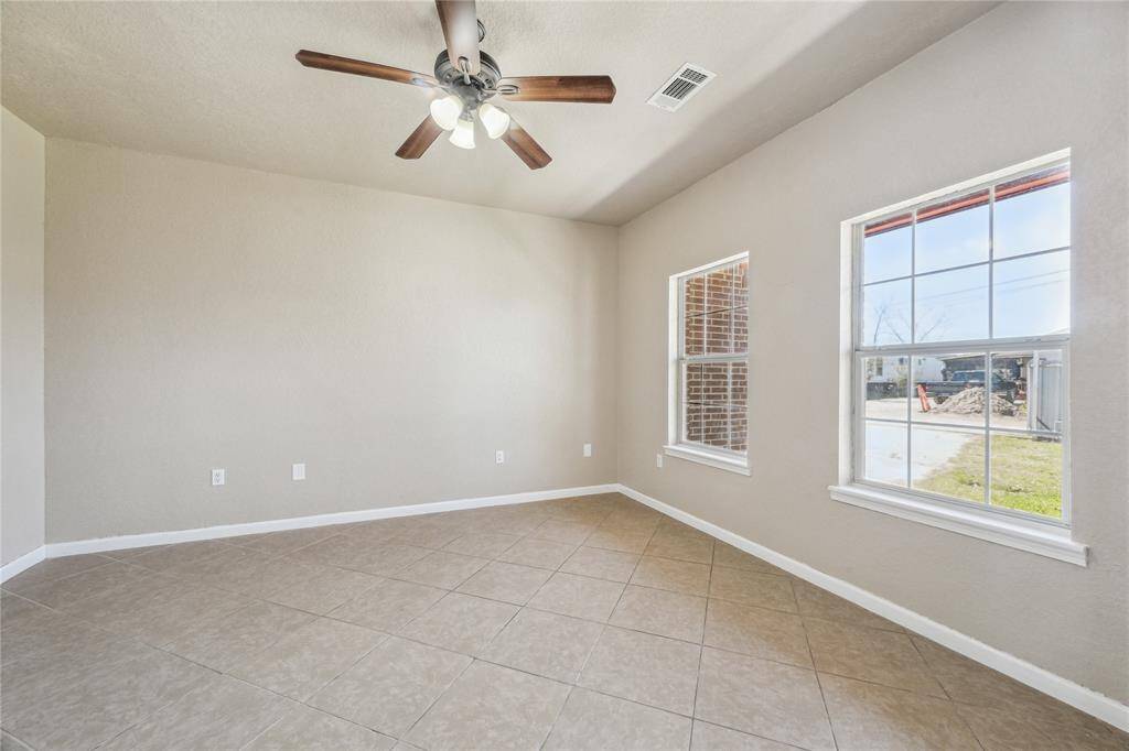 Ideal for daily use, this home office features great outdoor views.