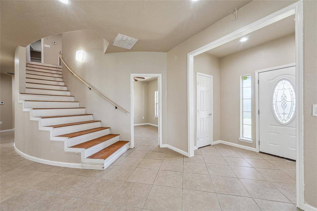 Welcome to a stunning foyer, setting the tone for elegance and charm as you enter the home.