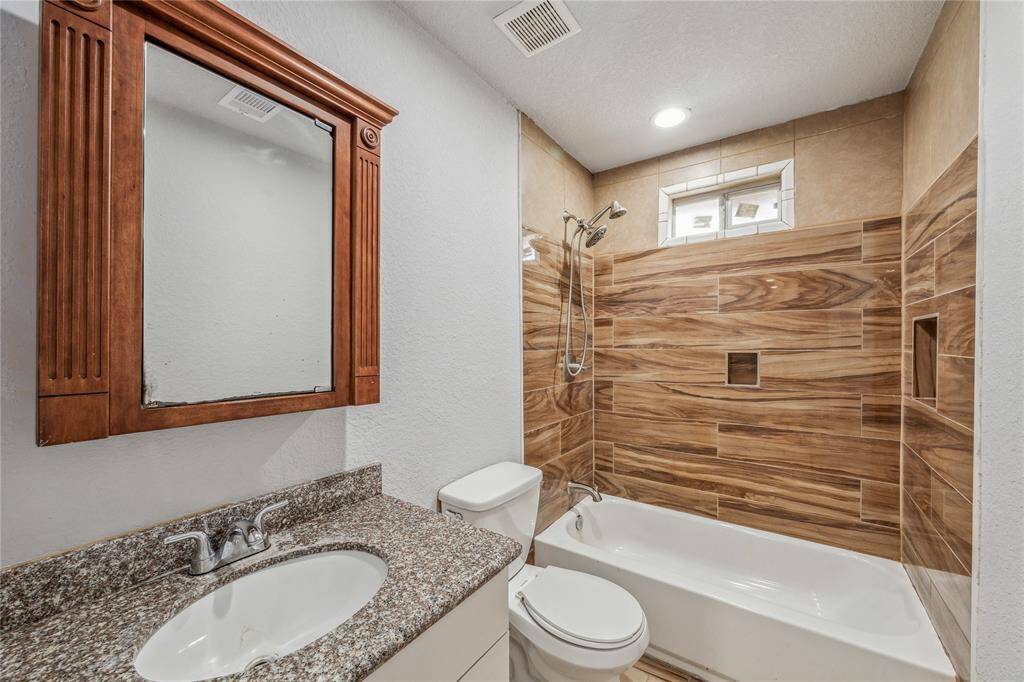 Experience relaxation in this upstairs bathroom with a convenient tub and shower combo.