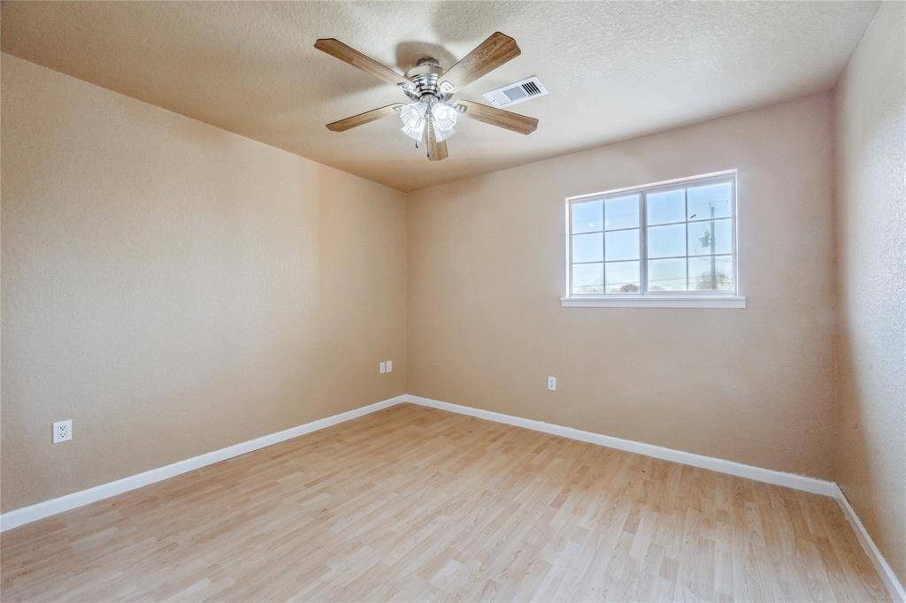 Another secondary upstairs bedroom.