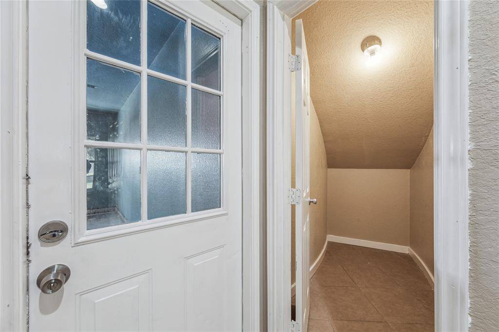 Maximize your storage with this convenient under-stair space, perfect for seasonal or everyday items, ideally located near the garage.