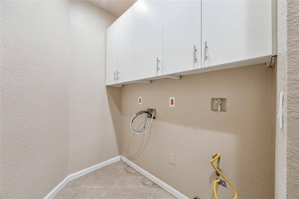 Conveniently located near the garage, the utility room offers easy access and functionality.