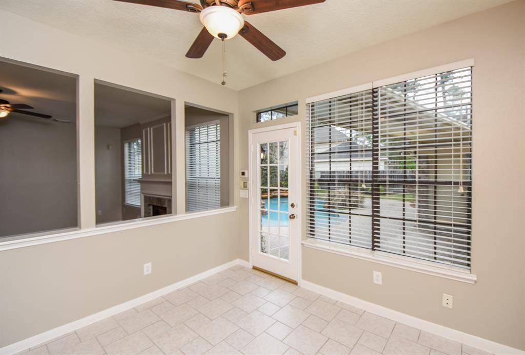 The breakfast room offers views of the large backyard.
