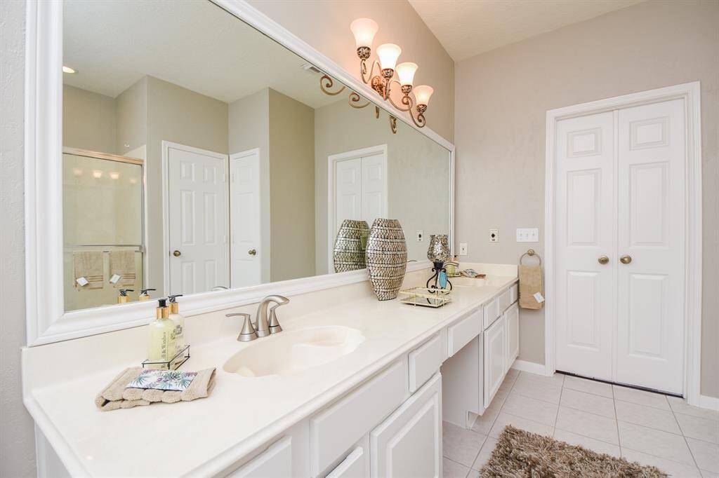 The primary ensuite bathroom showcases a large spa-like bathroom.