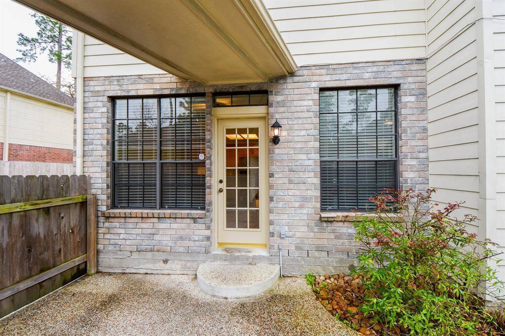 Outside, appreciate access to the garage with a covered breezeway.