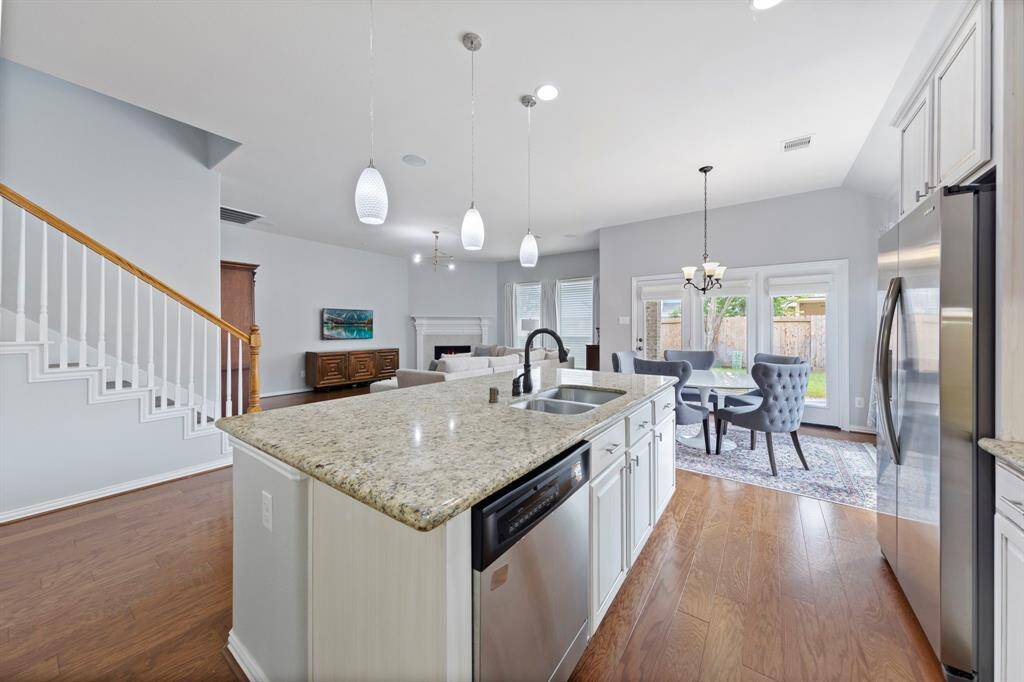 This open-concept layout effortlessly connects the kitchen, dining, and living areas, creating a spacious and inviting flow ideal for both everyday living and entertaining.